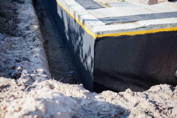 Professional Waterproofing technician working in Two Rivers, WI